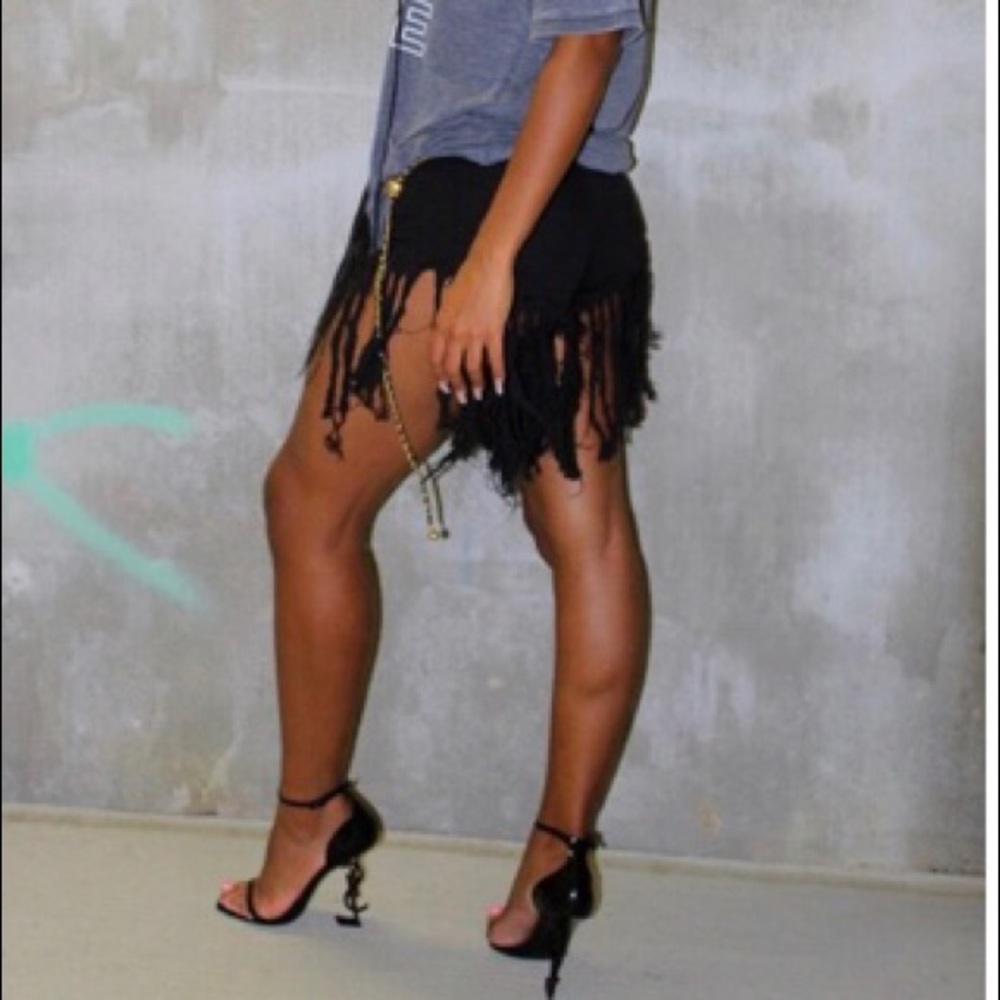 Black fringe jean shorts